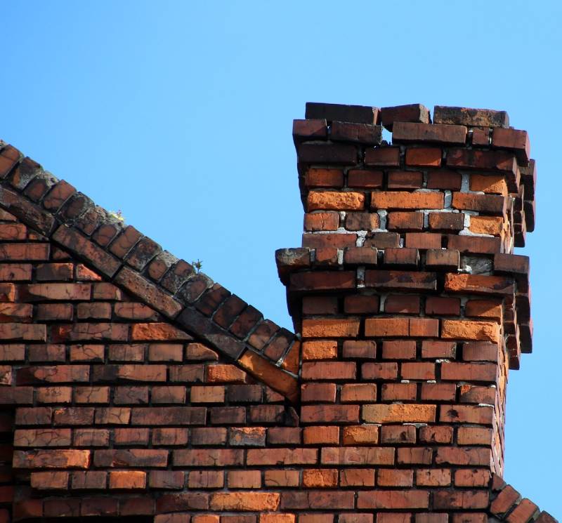 Signs Your New Carrollton Home Needs a Chimney Inspection Damaged chimney on an New Carrollton home showing cracks and missing mortar
